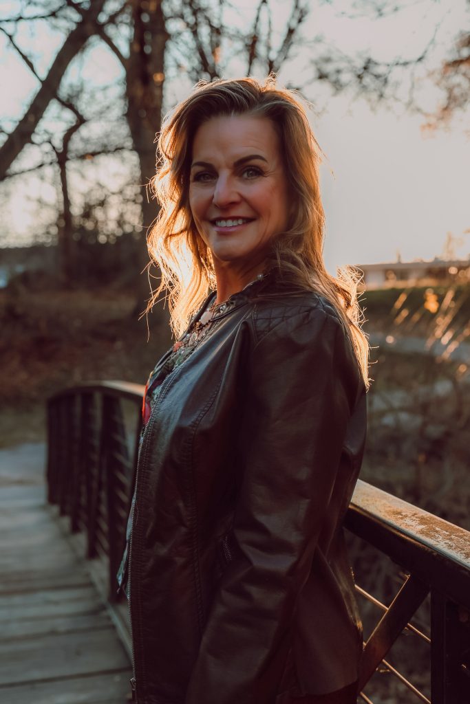 Chelle Rowan on a bridge Intuitive Life Guide and Healer  Coach 
