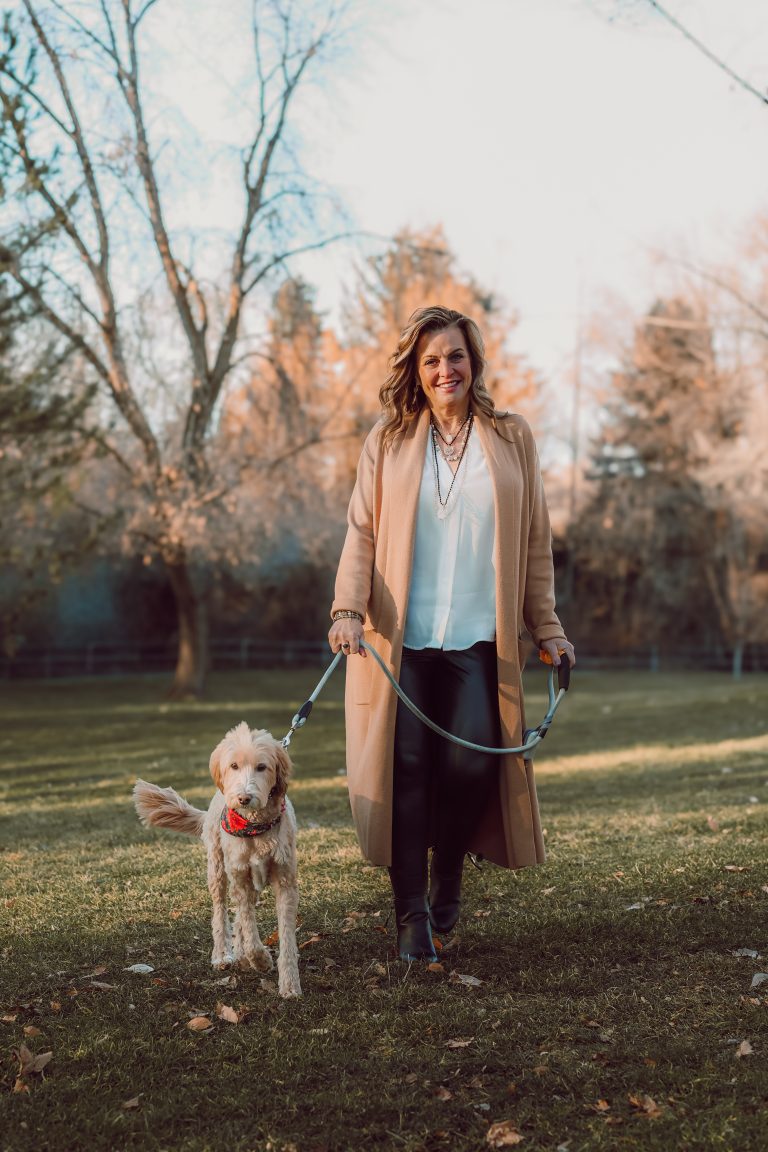 Chelle Rowan walking her dog. Holistic Life Coach for women